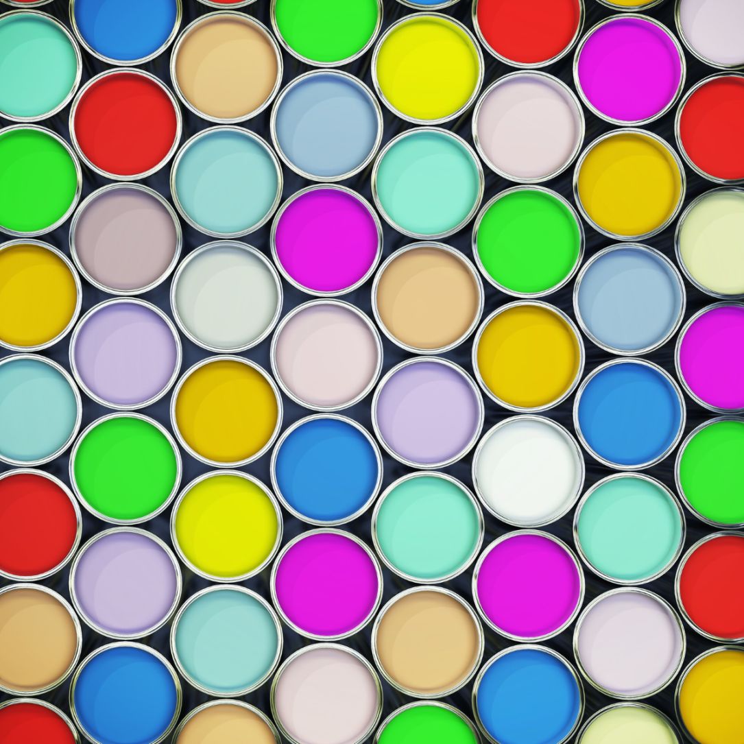 tins of paint opened with different colours